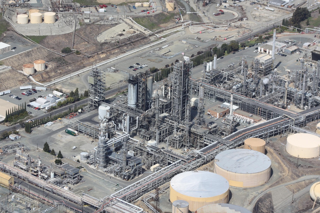 refinery storage tanks night